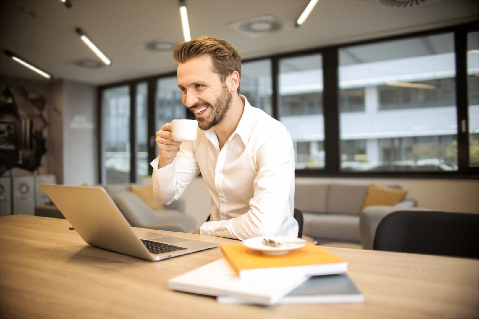 Man at desk with computer enjoying content filtering