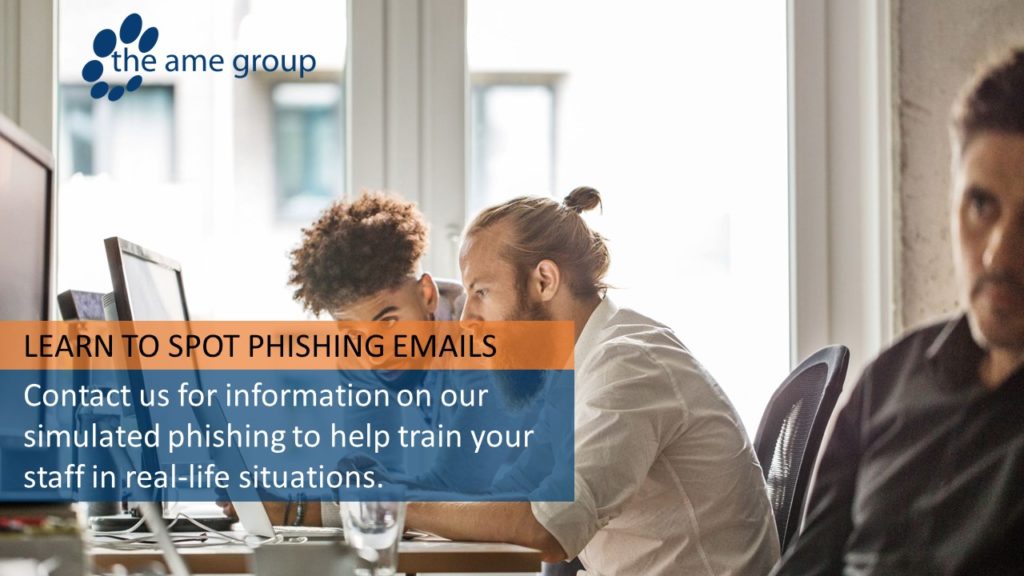 people looking at a computer learning how to spot a phishing email